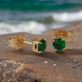 Topo  con piedra cristal Verde y Oro Laminado en la playa